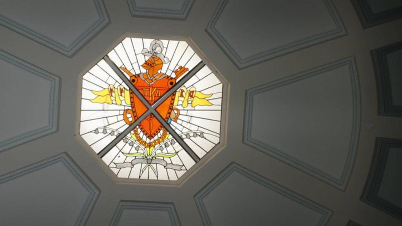 PIKE shield on a stained glass ceiling